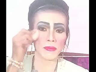 asian ladyboy strokes dick and fingers her ass