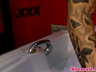 tattooed tgirl wanking in the bathroom